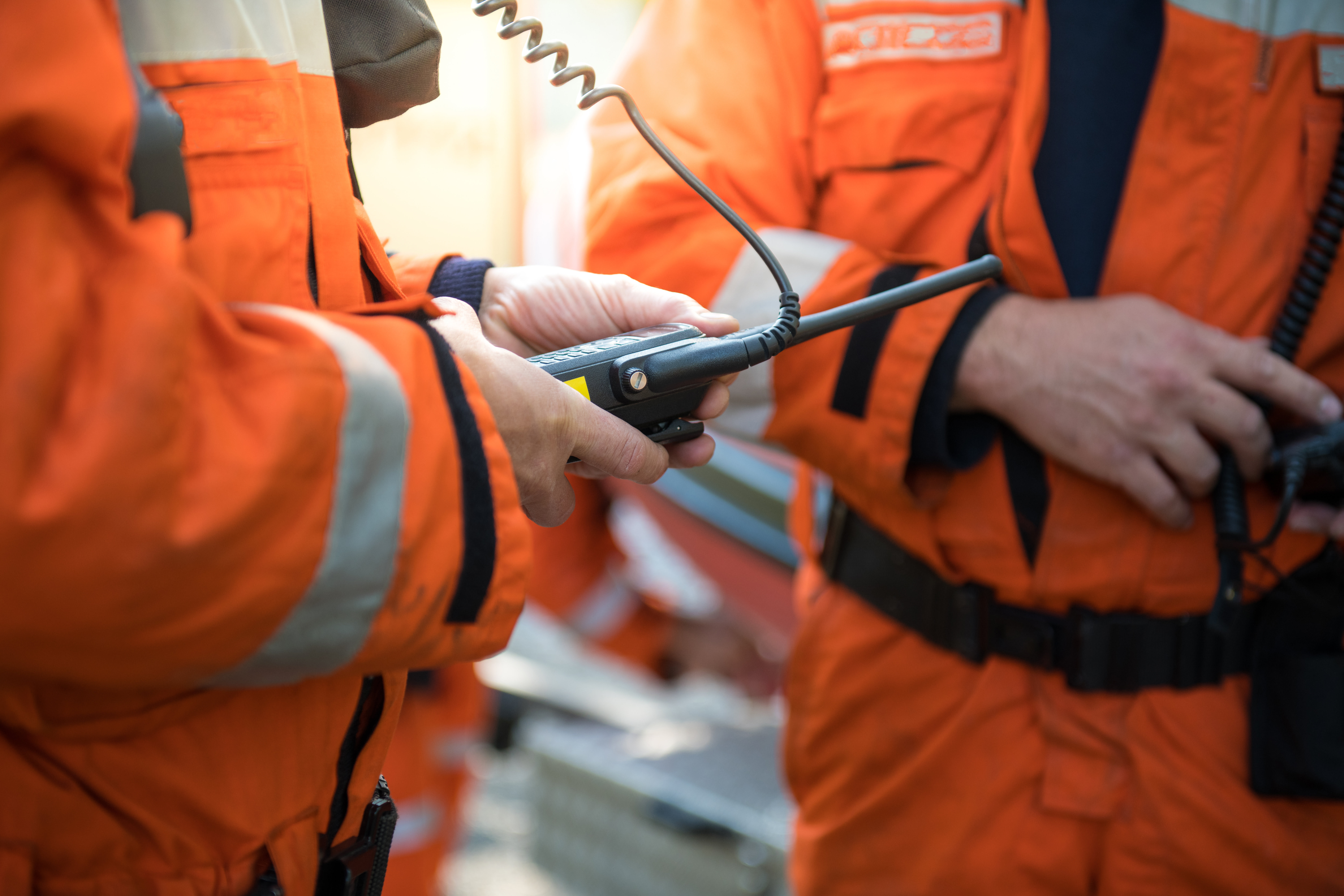 Firefighters using walkie talkie, rescue operation Close Up Brannmenn bruker walkie talkie